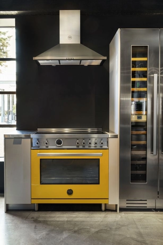 bertazzoni kitchen yellow stove and wine cellar