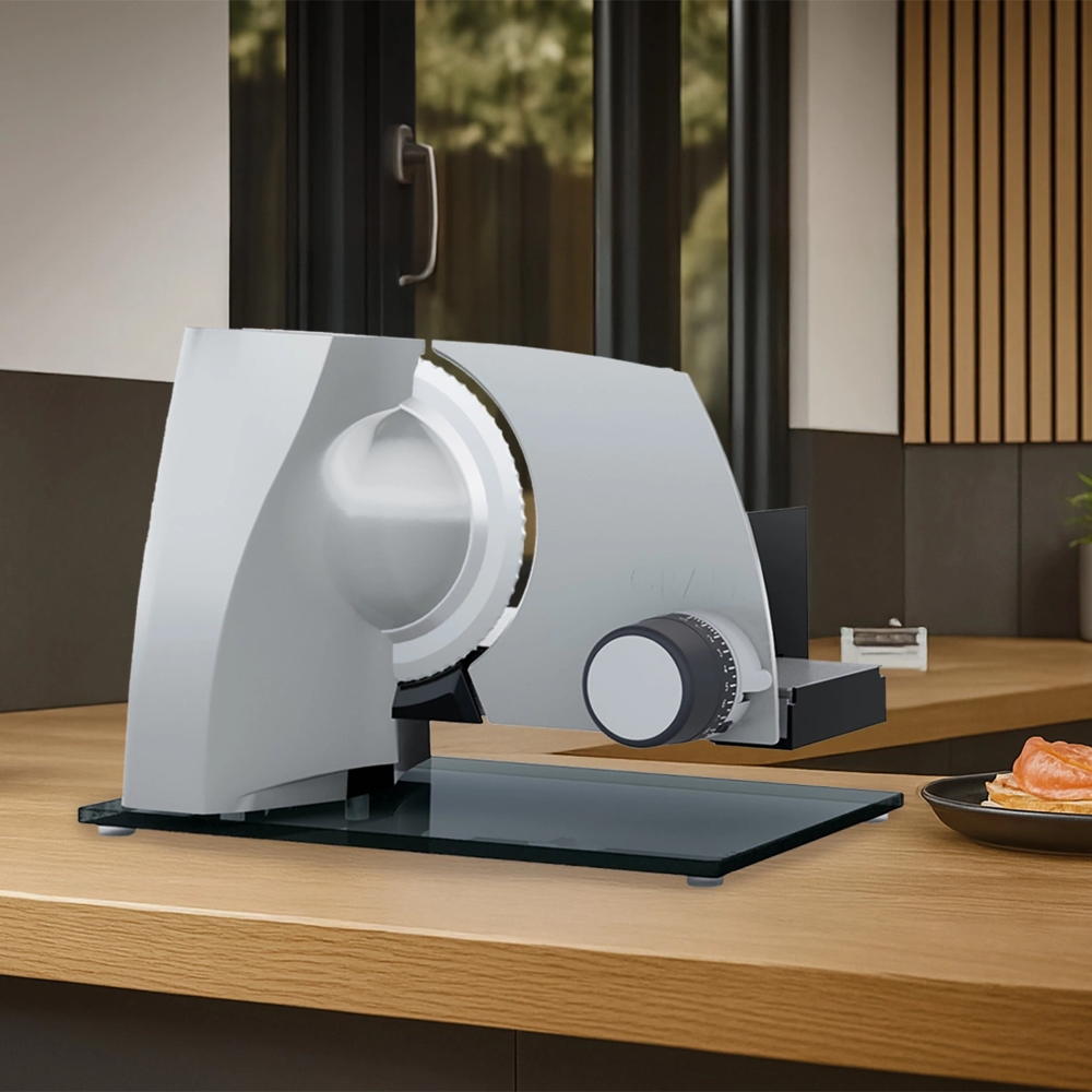 feliator electric pentru alimente, graef, essence, cu structura robusta din metal si baza din sticla, folosit in bucatarie pentru felierea diferitor alimente, argintiu